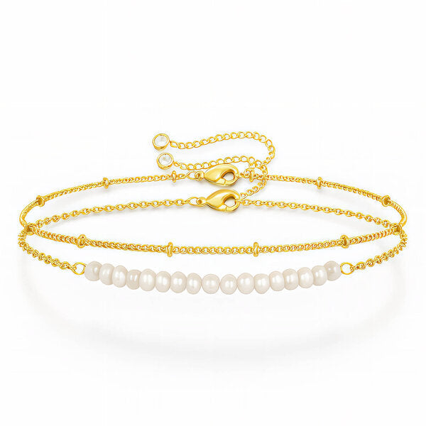Pulsera de perlas preciosa en Stainless Steel bañada en oro 18K, diseñada para aportar un toque de elegancia delicada y moderna en cualquier ocasión.